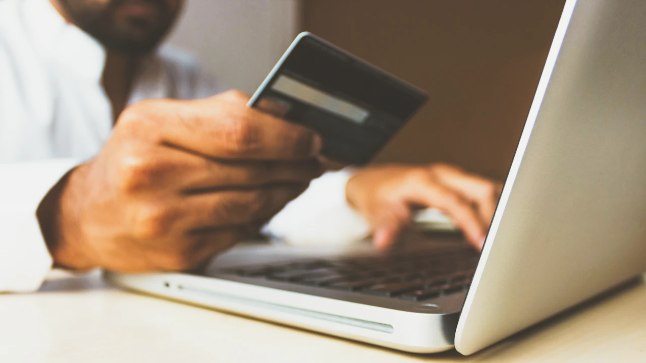 Paying rent online with a laptop